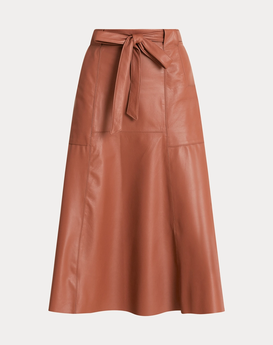 A Saia Midi Valeria é confeccionada em Couro, tecido com toque macio e acabamento sofisticado, que confere um visual moderno e imponente. 
<br/>