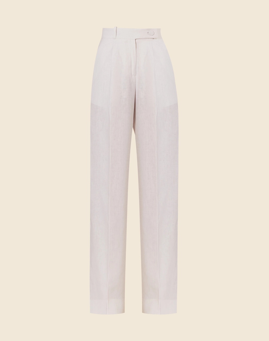 Calça Eugenia, confeccionado em linho. <br/>
Com modelagem pantalona, bolsos laterais estilo faca e bolsos decorativos atrás. <br/>
Seu cós é largo com passantes, seu fechamento é por dois botões forrados e zíper. <br/>
Possui pences frontais.<br/>