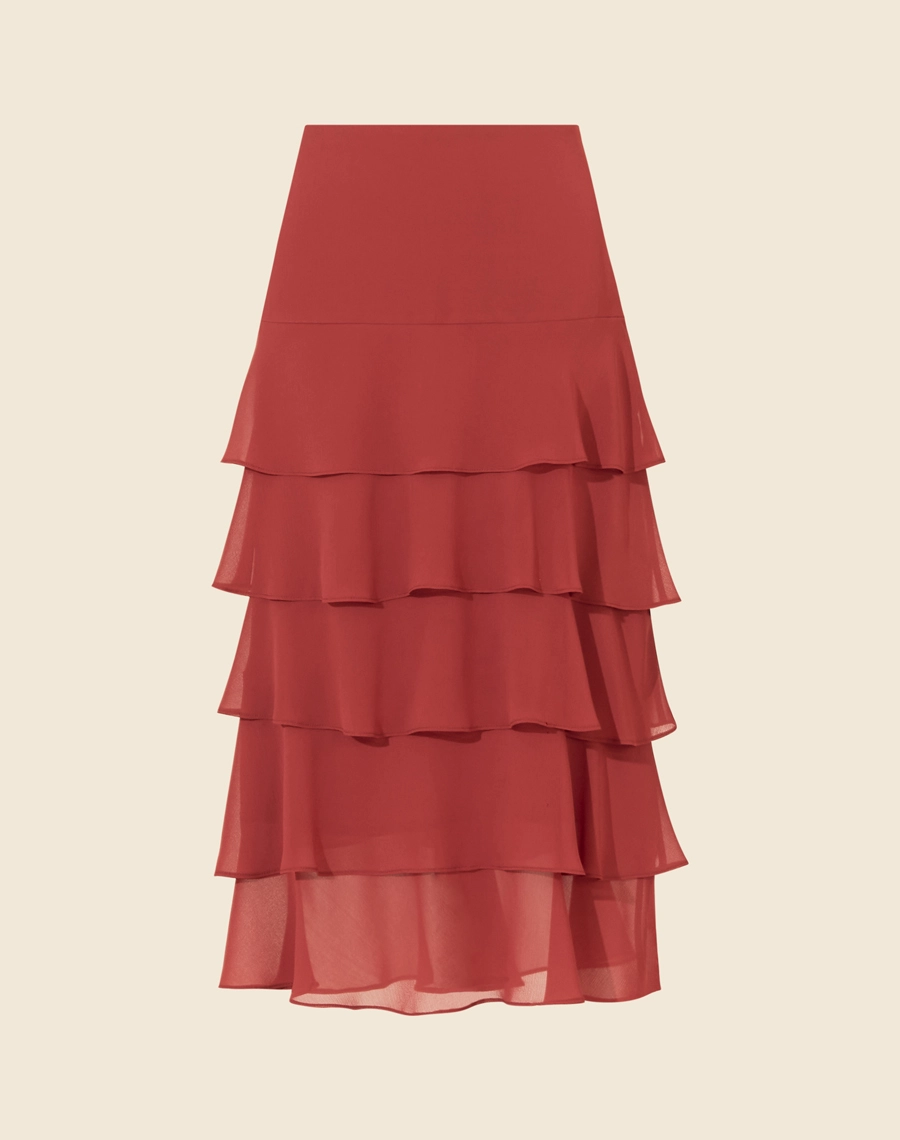 A Saia Midi Isabele é confeccionada em chiffon youro, um tecido leve e texturizado. É ideal para quem busca um look sofisticado e versátil, perfeito para diversas ocasiões.