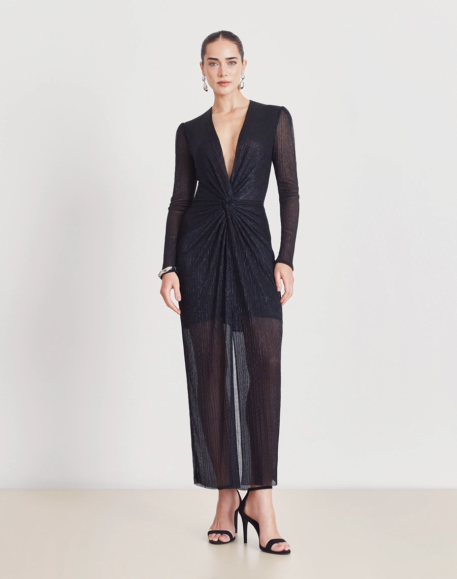 Vestido Longo Erica confeccionado em malha plissada metálica, tecido leve e confortável, com caimento fluido e toque macio. Ideal para peças sofisticadas com movimento e elegância.