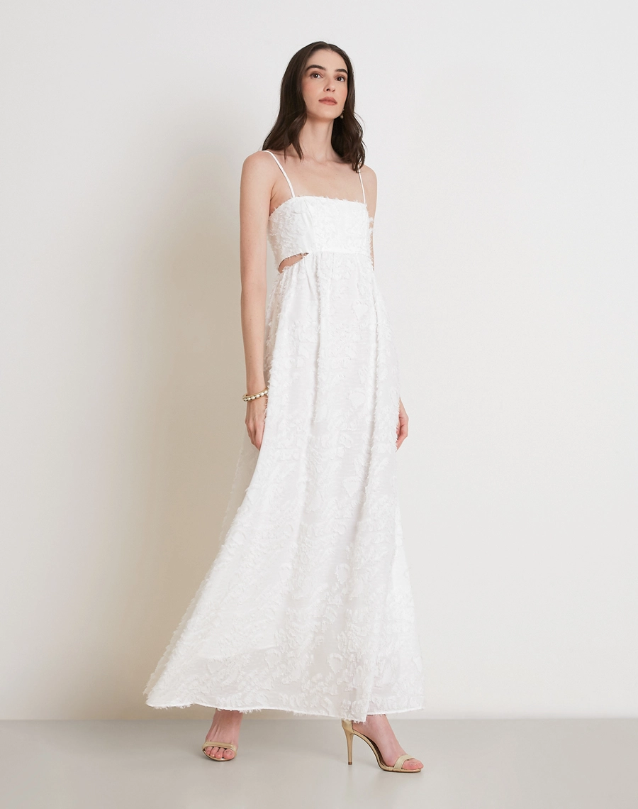 O Vestido Longo Anahi é confeccionado em Jacquard, tecido elegante e texturizado, conhecido pelo relevo suave e pelinhos que adicionam volume e sofisticação.