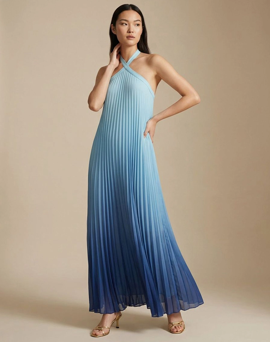 O Vestido Longo Thassia é confeccionado em Chiffon, tecido leve e sofisticado, possui transparência sutil e caimento fluido que valoriza o movimento da peça.