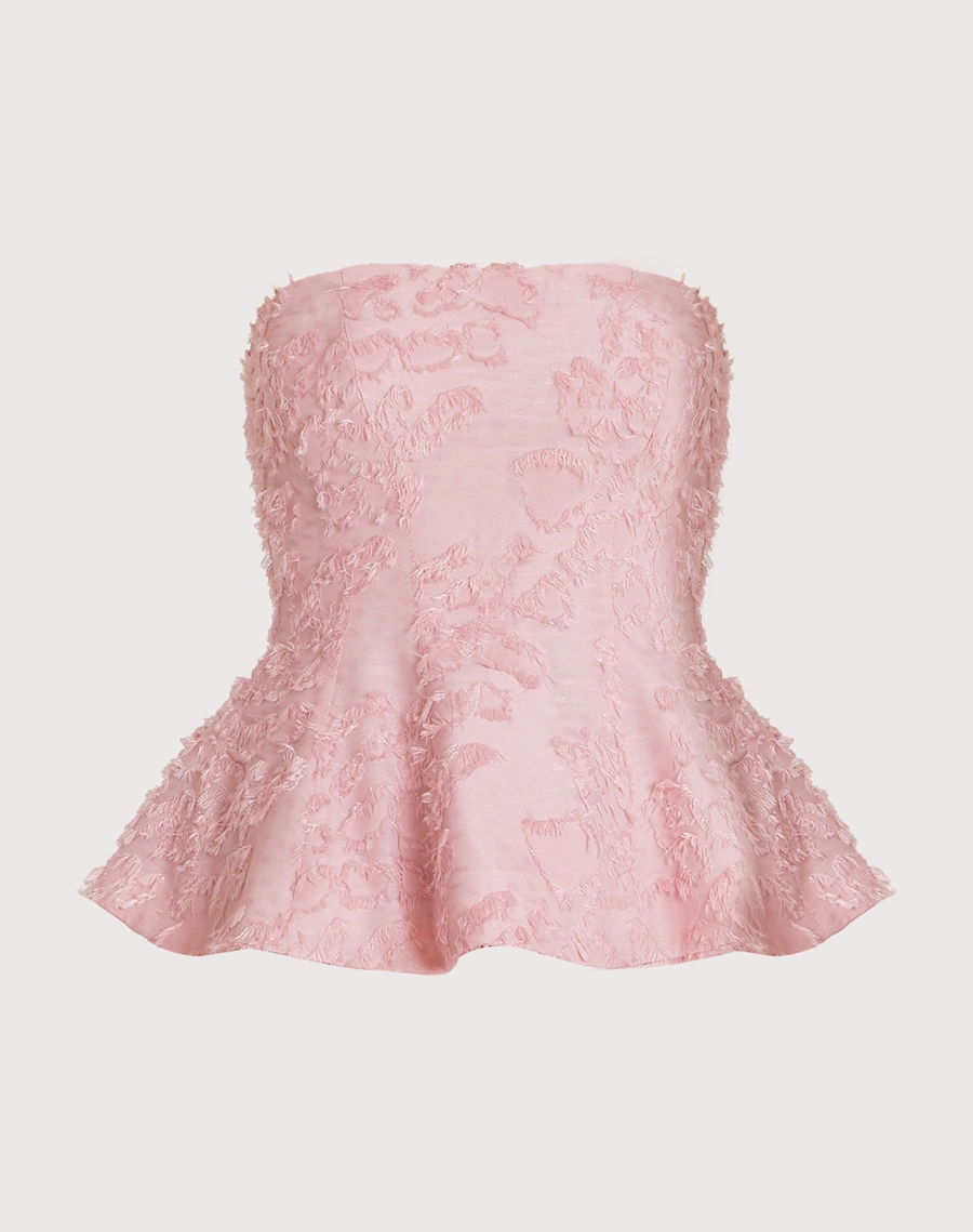 O Top Anahi é confeccionado em jacquard, tecido de textura sofisticada e toque macio, que se destaca pelo relevo delicado e acabamento elegante.